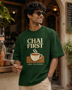 Man wearing REBELO Chai First bottle green oversized graphic T-shirt