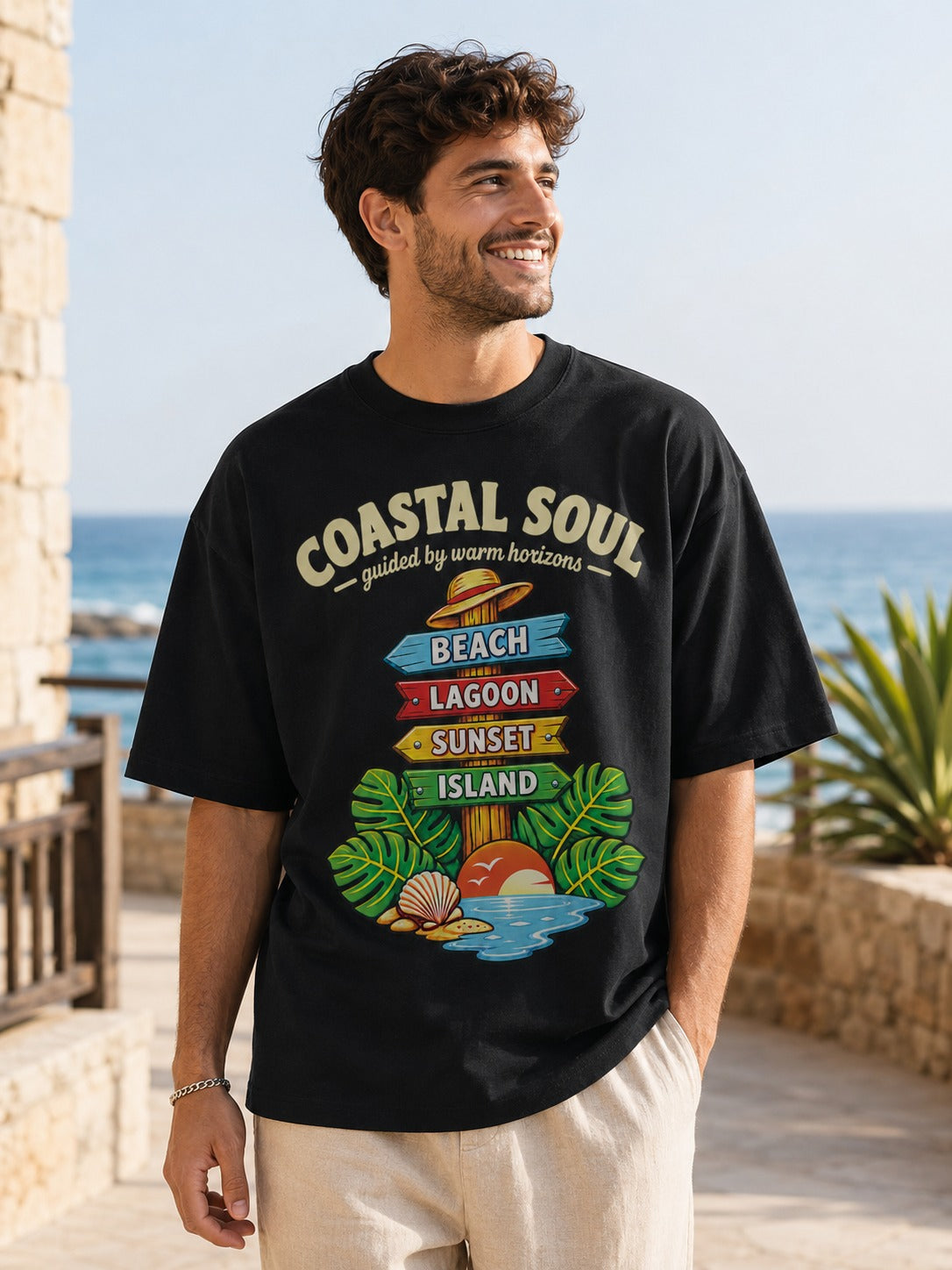 Man wearing Coastal Soul oversized T-shirt in black