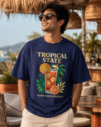 Man wearing REBELO Tropical State royal blue oversized graphic T-shirt