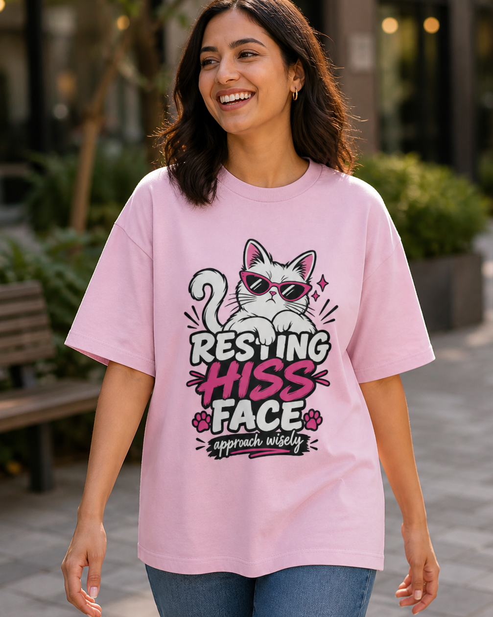 Model wearing Resting Hiss Face cat lover oversized T-shirt in Light Baby Pink